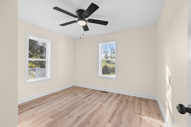 spare room with ceiling fan and light hardwood / wood-style floors