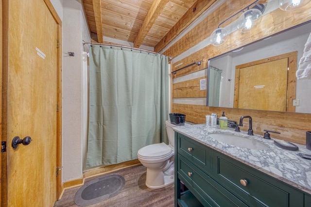 bathroom featuring wooden ceiling, beamed ceiling, toilet, wood finished floors, and vanity