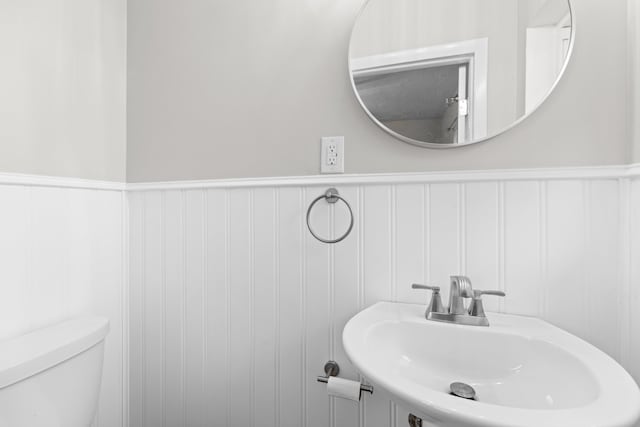 bathroom with toilet and sink