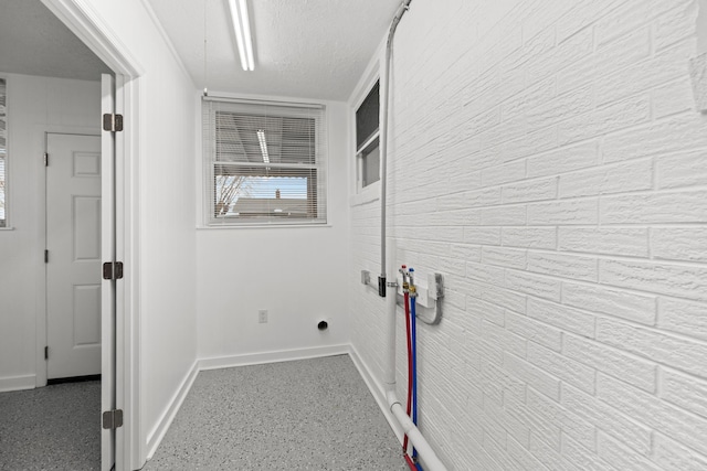 washroom with a textured ceiling