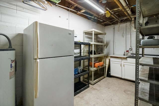 basement with white refrigerator and electric water heater