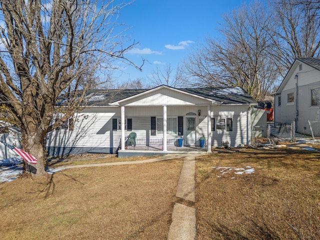 bungalow-style home with a porch and a front yard