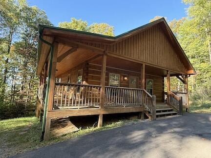 view of side of home featuring a porch