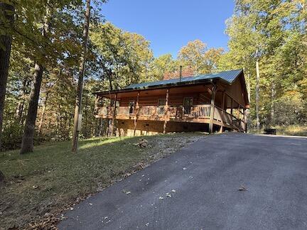 view of property exterior featuring a wooden deck