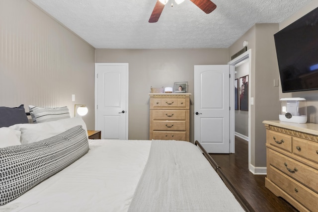 2121 Fir St, Morristown, TN 37813 - bedroom with dark wood-type flooring, a textured ceiling, baseboards, and a ceiling fan