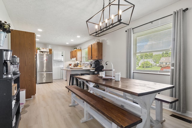 2121 Fir St, Morristown, TN 37813 - dining area with recessed lighting, washer / dryer, light wood-style floors, and a textured ceiling