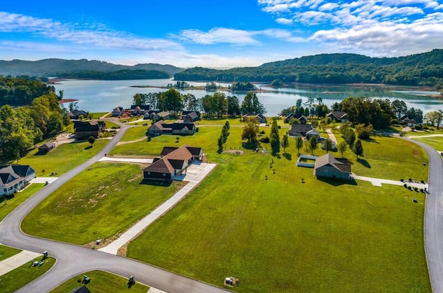 aerial view featuring a water and mountain view