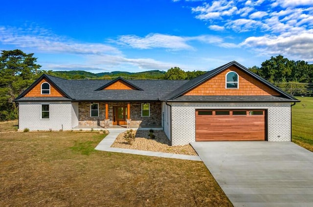 view of front of house with a porch, a front yard, and a garage