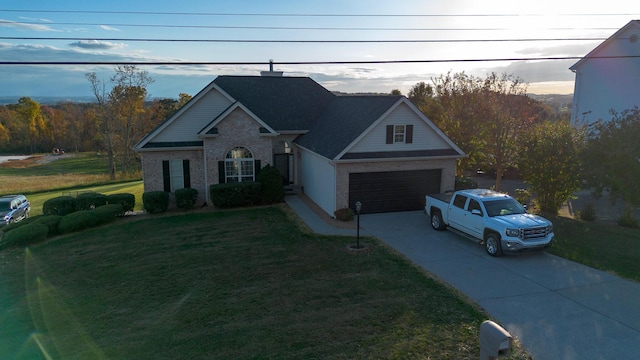 view of front of home with a garage and a front yard