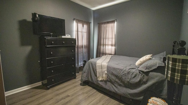 bedroom with light hardwood / wood-style floors