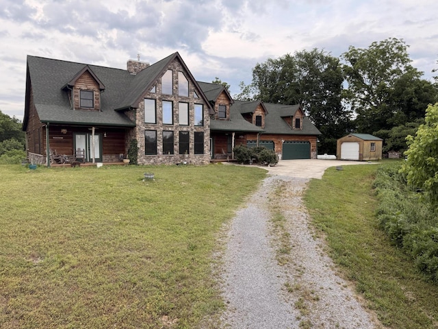2760 Forest Ridge Rd, Dandridge, TN 37725 - view of front of house featuring driveway, covered porch, a front yard, an outbuilding, and stone siding