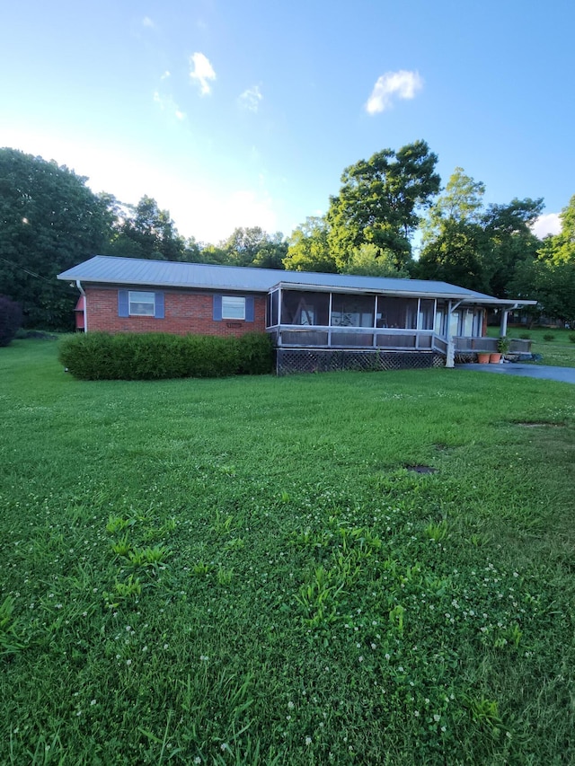 204 Clearview Dr, Bean Station, TN 37708 - view of front of home with a sunroom, a front lawn, and brick siding