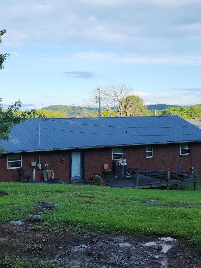 204 Clearview Dr, Bean Station, TN 37708 - rear view of house featuring brick siding, a yard, and metal roof