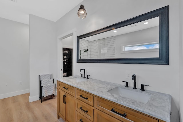 1936 Turners Landing Rd, Russellville, TN 37860 - bathroom featuring a tile shower, hardwood / wood-style floors, and vanity