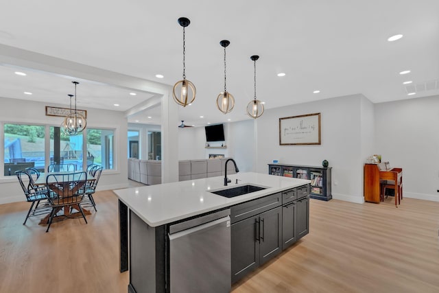 1936 Turners Landing Rd, Russellville, TN 37860 - kitchen featuring dishwasher, sink, light hardwood / wood-style flooring, an island with sink, and decorative light fixtures