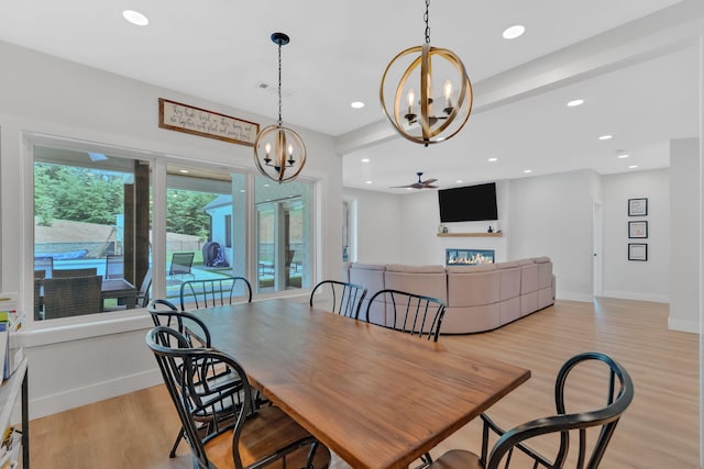 1936 Turners Landing Rd, Russellville, TN 37860 - dining space with ceiling fan with notable chandelier and light hardwood / wood-style floors