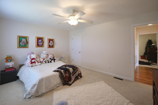 bedroom featuring ceiling fan and light colored carpet