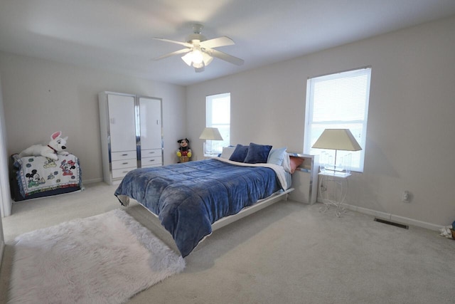 carpeted bedroom with ceiling fan