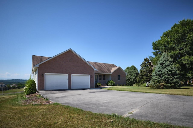ranch-style house with a garage and a front yard
