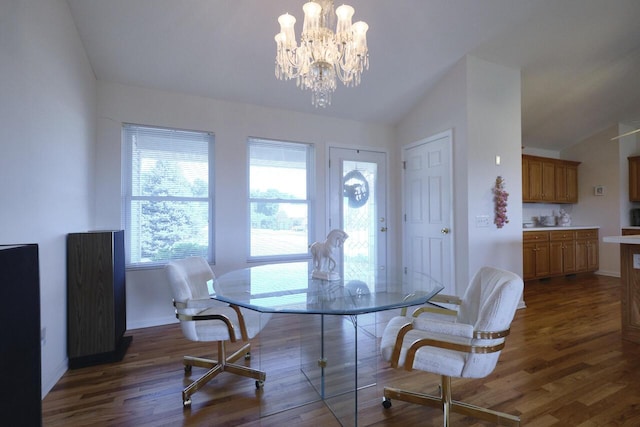 dining space with a chandelier, vaulted ceiling, and dark wood-type flooring