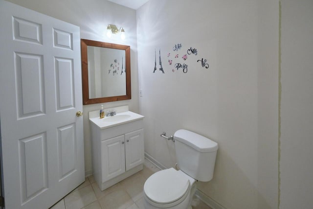 bathroom with tile patterned floors, vanity, and toilet