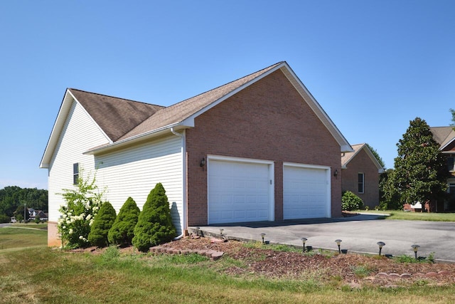 view of side of home featuring a garage