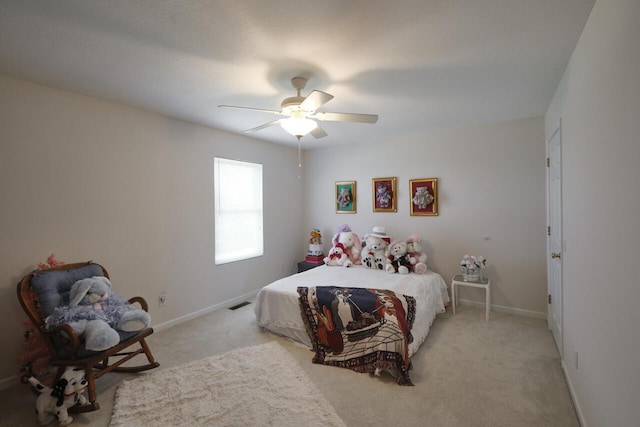 carpeted bedroom with ceiling fan