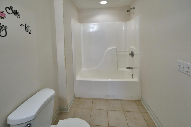 bathroom with bathing tub / shower combination, tile patterned flooring, and toilet