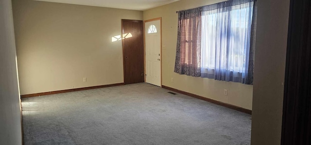 view of carpeted entrance foyer