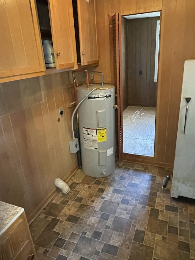 utility room featuring water heater