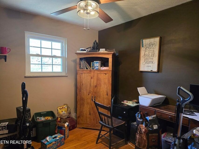 office featuring wood finished floors and ceiling fan