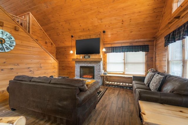 living room featuring wood ceiling, a fireplace, a healthy amount of sunlight, and hardwood / wood-style flooring