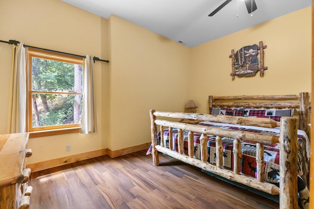 bedroom featuring hardwood / wood-style flooring and ceiling fan