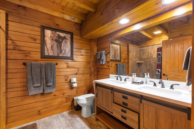 bathroom featuring wood ceiling, vanity, wooden walls, beam ceiling, and hardwood / wood-style floors