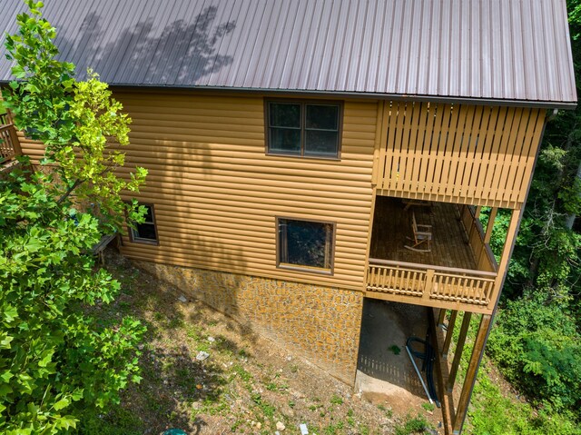 view of side of home featuring a balcony