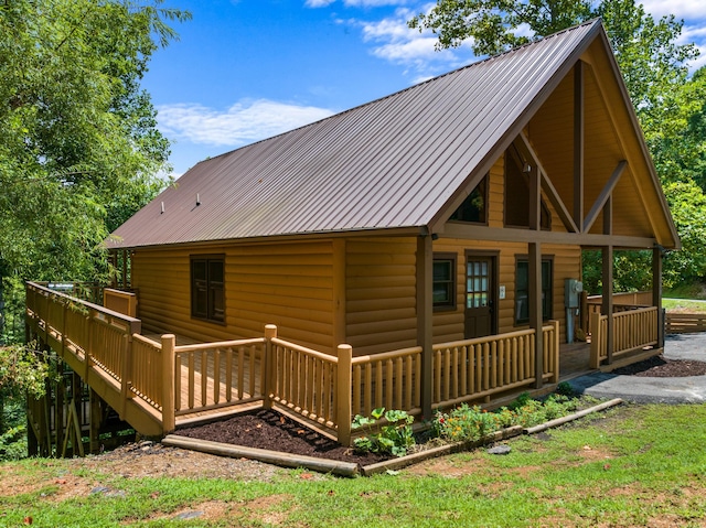 back of house featuring a porch