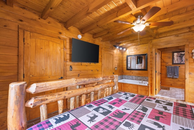 bedroom with wood walls, wood ceiling, beam ceiling, and ensuite bath