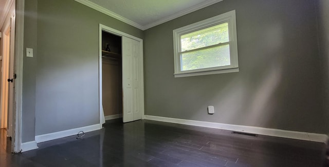 1034 E Skyline Dr, Morristown, TN 37813 - unfurnished bedroom with crown molding, a closet, and dark wood finished floors