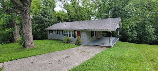 1034 E Skyline Dr, Morristown, TN 37813 - single story home with driveway, an attached carport, a front lawn, and a metal roof