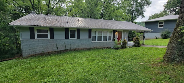 1034 E Skyline Dr, Morristown, TN 37813 - view of front of house with a front yard, brick siding, and a metal roof