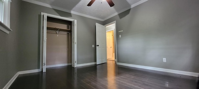 1034 E Skyline Dr, Morristown, TN 37813 - unfurnished bedroom with dark wood finished floors, a closet, a ceiling fan, ornamental molding, and a textured ceiling