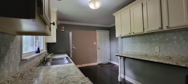 1034 E Skyline Dr, Morristown, TN 37813 - kitchen featuring backsplash, ornamental molding, white cabinetry, freestanding refrigerator, and ventilation hood