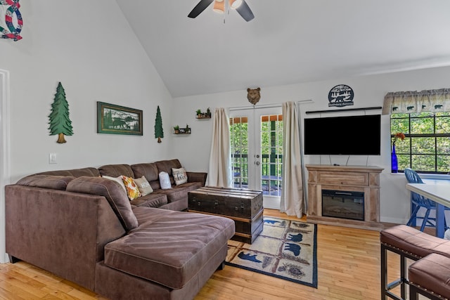 5014 Latta Way, Gatlinburg, TN 37738 - living area featuring high vaulted ceiling, hardwood / wood-style flooring, a ceiling fan, and a glass covered fireplace