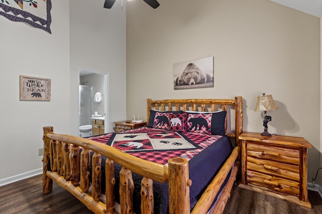 5014 Latta Way, Gatlinburg, TN 37738 - bedroom featuring a ceiling fan, ensuite bath, wood finished floors, and baseboards