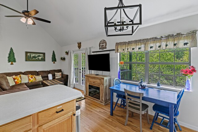 5014 Latta Way, Gatlinburg, TN 37738 - interior space with lofted ceiling, light wood-type flooring, and ceiling fan with notable chandelier