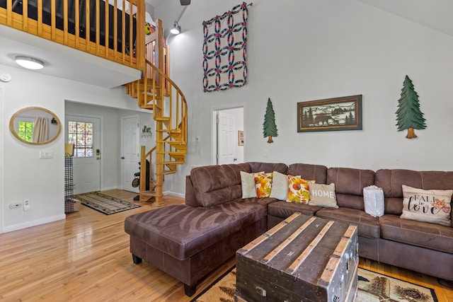 5014 Latta Way, Gatlinburg, TN 37738 - living area featuring stairs, a high ceiling, baseboards, and wood finished floors