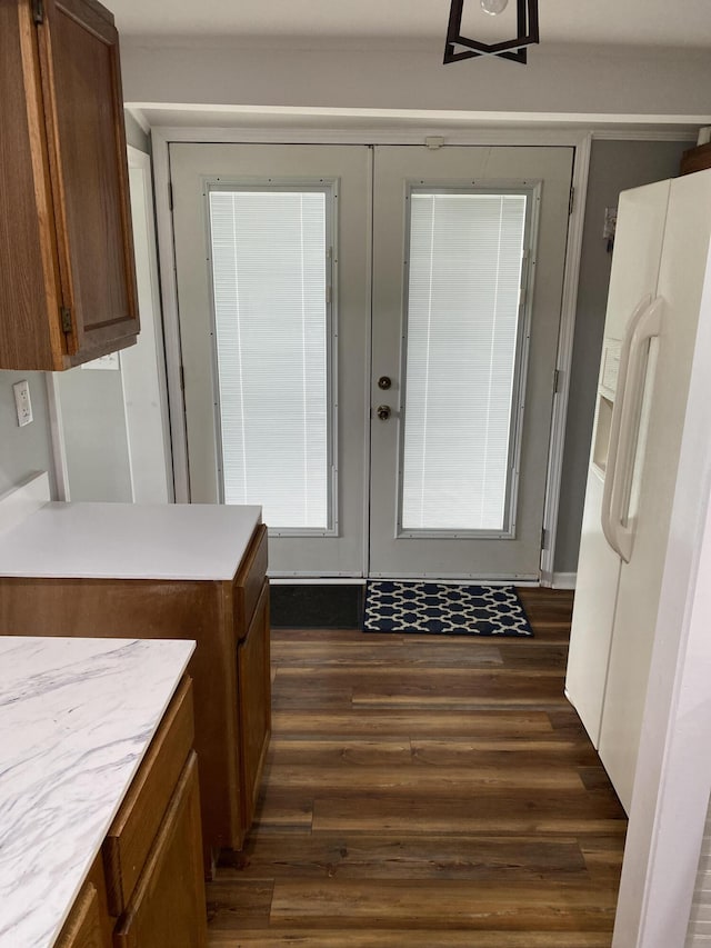 entryway with french doors and dark wood-type flooring