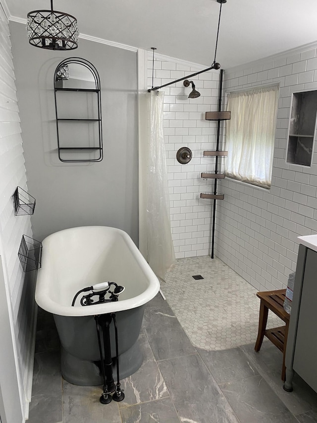 bathroom with separate shower and tub and ornamental molding