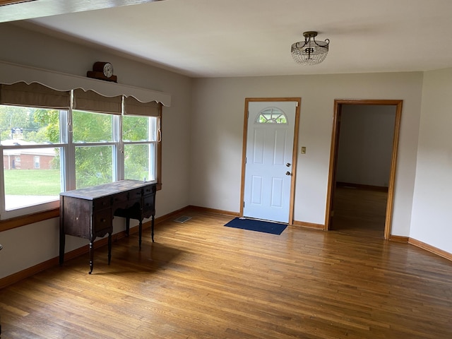 entrance foyer with a chandelier and light wood-type flooring