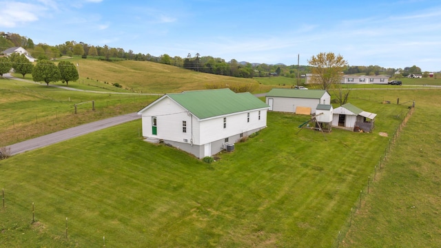 birds eye view of property with a rural view